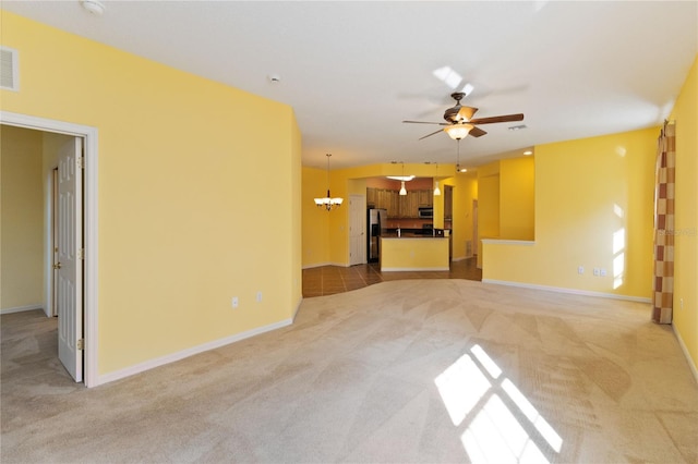 3401 Home Town Ln, Saint Cloud, FL 34769 - unfurnished living room featuring light carpet, a chandelier, ceiling fan, and baseboards