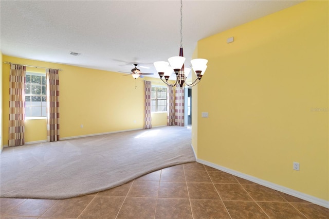 3401 Home Town Ln, Saint Cloud, FL 34769 - spare room with dark colored carpet, plenty of natural light, a chandelier, and baseboards