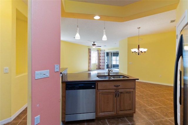 3401 Home Town Ln, Saint Cloud, FL 34769 - kitchen with appliances with stainless steel finishes, a sink, dark countertops, and track lighting