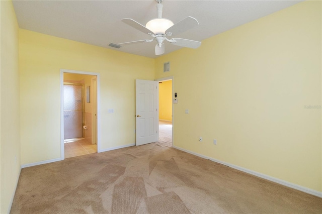3401 Home Town Ln, Saint Cloud, FL 34769 - unfurnished bedroom featuring light carpet, baseboards, ensuite bathroom, and ceiling fan