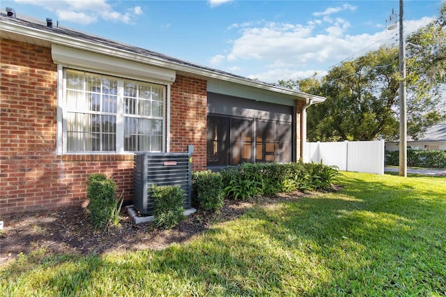 3401 Home Town Ln, Saint Cloud, FL 34769 - view of property exterior featuring central AC unit and brick siding