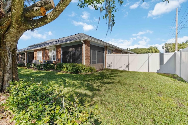 3401 Home Town Ln, Saint Cloud, FL 34769 - view of yard with a sunroom and a garage
