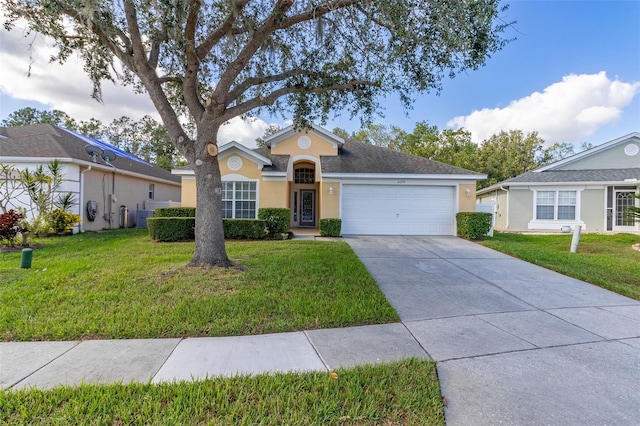 single story home with a front yard and a garage