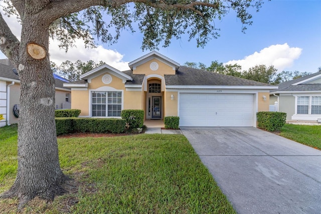 ranch-style house with a front yard and a garage