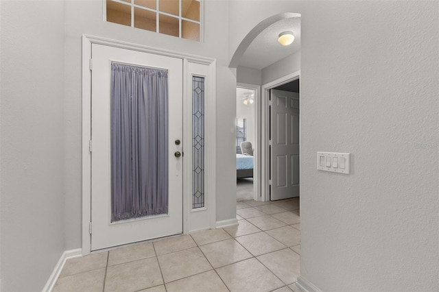 entryway with light tile patterned floors