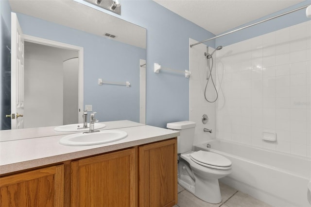 full bathroom with tile patterned floors, vanity, bathing tub / shower combination, and toilet