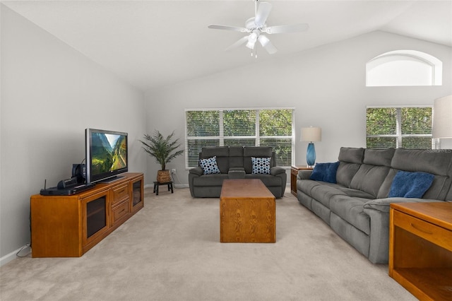 living room featuring high vaulted ceiling, ceiling fan, and light colored carpet