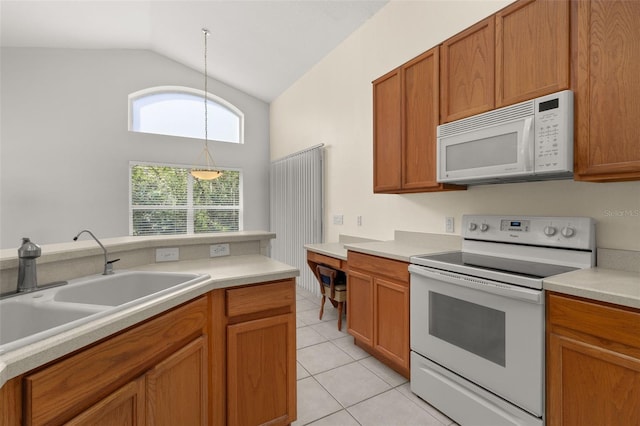 kitchen featuring sink, high vaulted ceiling, hanging light fixtures, light tile patterned floors, and white appliances