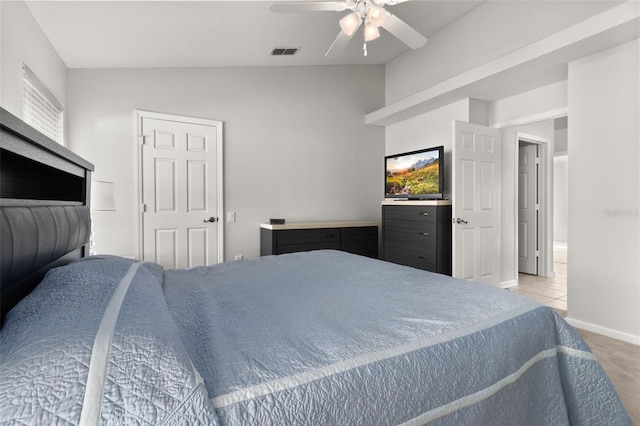 carpeted bedroom with ceiling fan and lofted ceiling