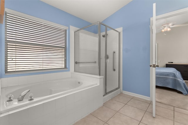 bathroom featuring tile patterned floors, ceiling fan, and a shower with shower door