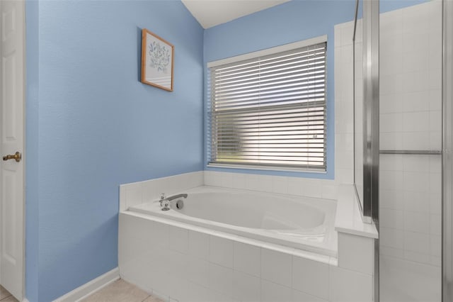 bathroom featuring plus walk in shower and tile patterned floors