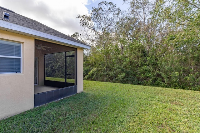 view of yard with a sunroom