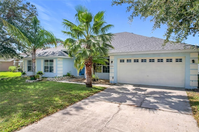 ranch-style home featuring a front lawn and a garage