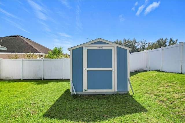 view of outbuilding featuring a yard