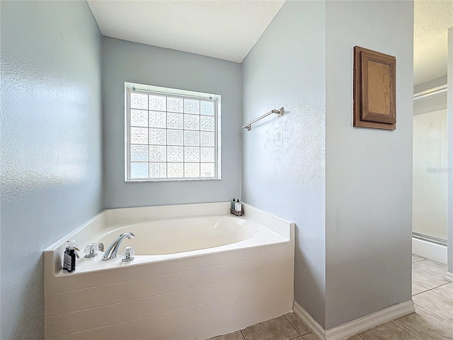 bathroom featuring tile patterned floors and plus walk in shower