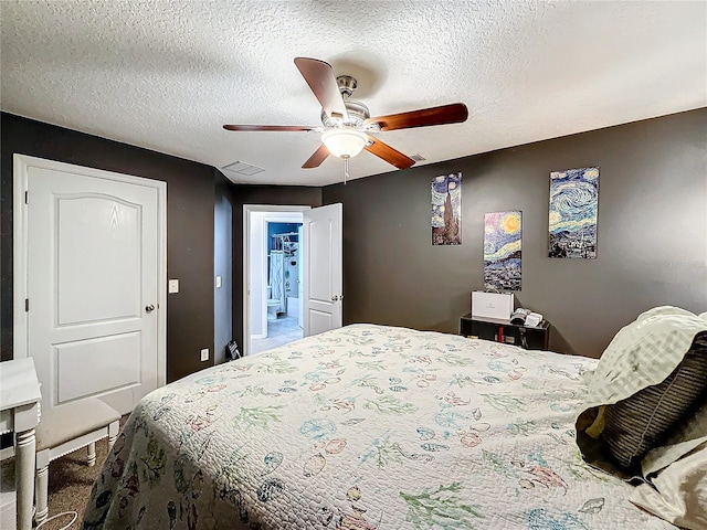 bedroom with ceiling fan, a closet, and a textured ceiling