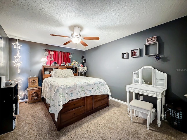 bedroom featuring carpet, ceiling fan, and a textured ceiling