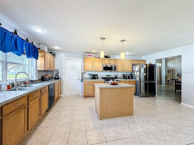 kitchen featuring sink, black appliances, pendant lighting, a kitchen island, and light tile patterned flooring