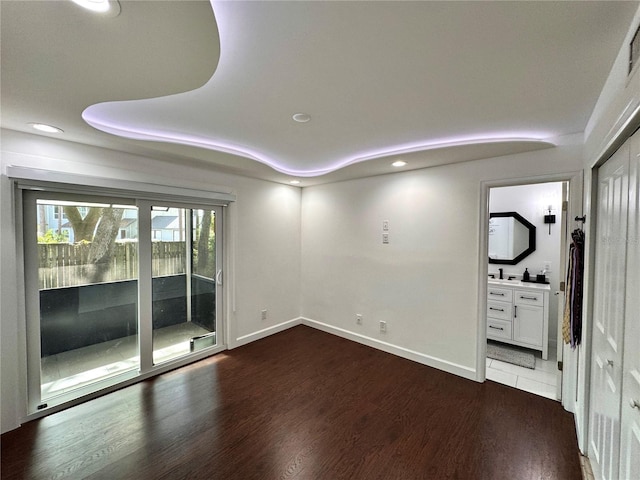 spare room featuring dark hardwood / wood-style floors