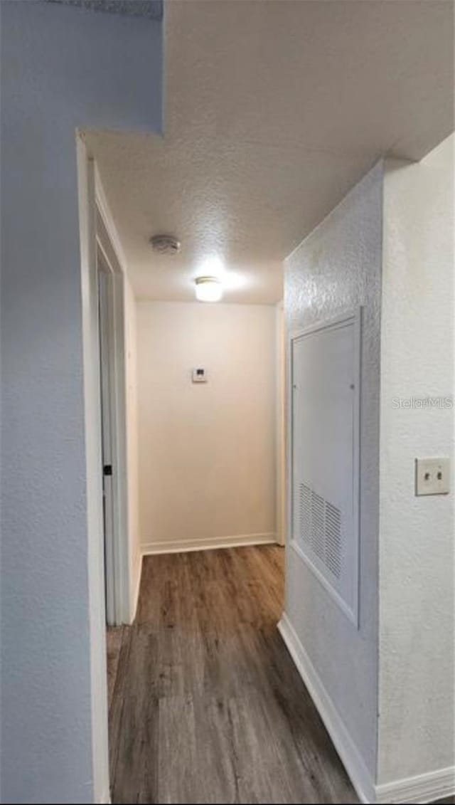 hall with dark hardwood / wood-style floors