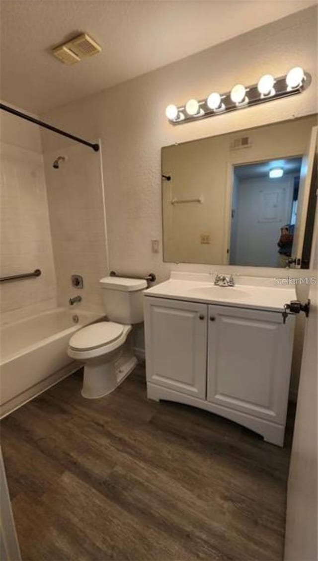 1025 S Hiawassee Rd Unit 2216, Orlando, FL 32835 - bathroom featuring wood finished floors, toilet, shower / bath combination, and vanity