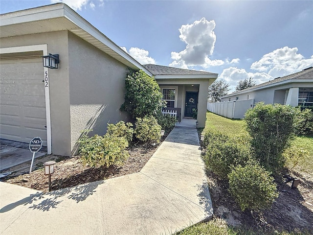 property entrance featuring a garage