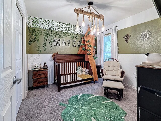 502 Pentas Ln, Haines City, FL 33844 - carpeted bedroom featuring a textured wall and baseboards