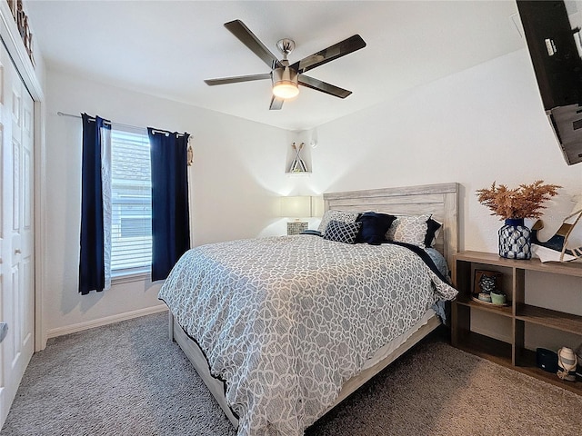 carpeted bedroom featuring ceiling fan and a closet