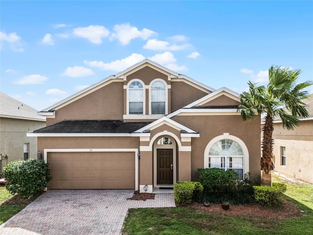 view of front of property with a garage