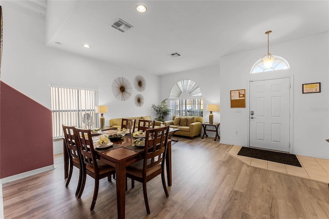 131 Cadiz Loop, Davenport, FL 33837 - dining area with healthy amount of natural light, wood finished floors, and recessed lighting