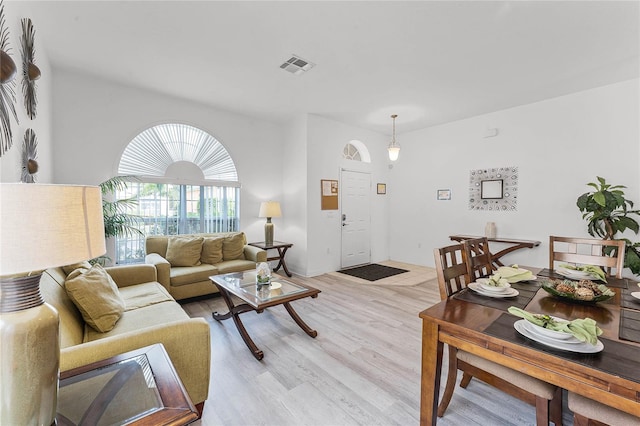 living room with light hardwood / wood-style flooring