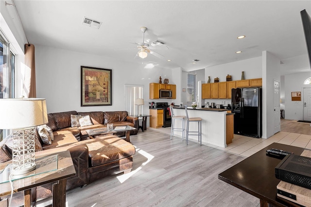 131 Cadiz Loop, Davenport, FL 33837 - living area featuring ceiling fan, recessed lighting, and light wood finished floors