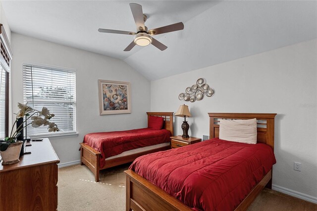 131 Cadiz Loop, Davenport, FL 33837 - bedroom with light carpet, vaulted ceiling, baseboards, and a ceiling fan