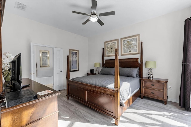 bedroom with light hardwood / wood-style floors and ceiling fan