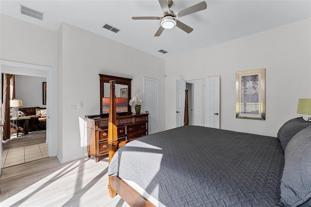 bedroom with ceiling fan and light hardwood / wood-style floors