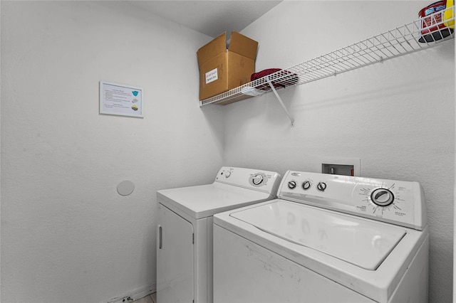 laundry room with washer and dryer