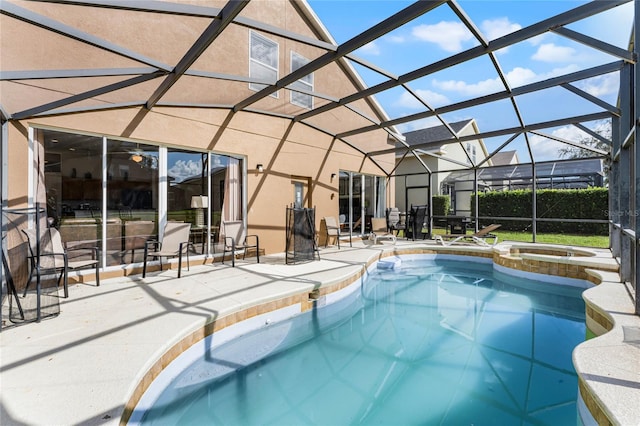 view of swimming pool with a patio area, an in ground hot tub, and glass enclosure