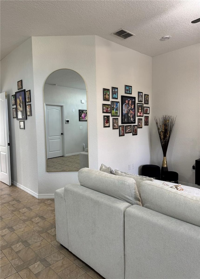 living room featuring a textured ceiling