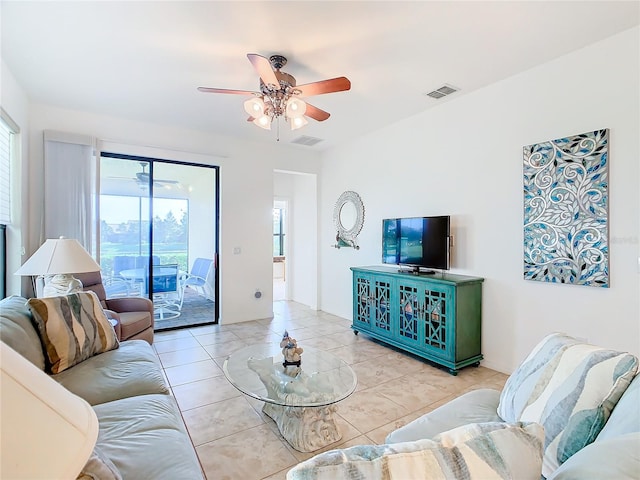 living room featuring ceiling fan and light tile patterned floors