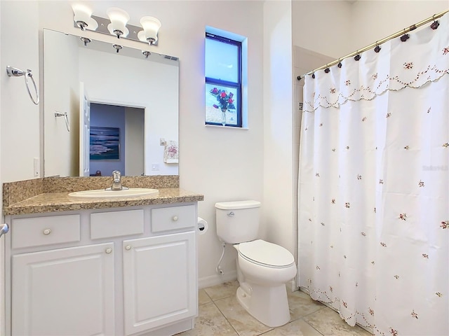 bathroom with tile patterned flooring, vanity, toilet, and a shower with curtain