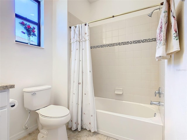 full bathroom featuring tile patterned flooring, vanity, toilet, and shower / tub combo with curtain