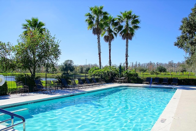 view of swimming pool with a patio area