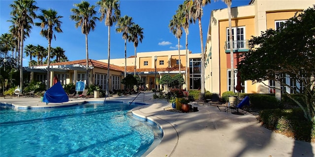 view of swimming pool featuring a patio area