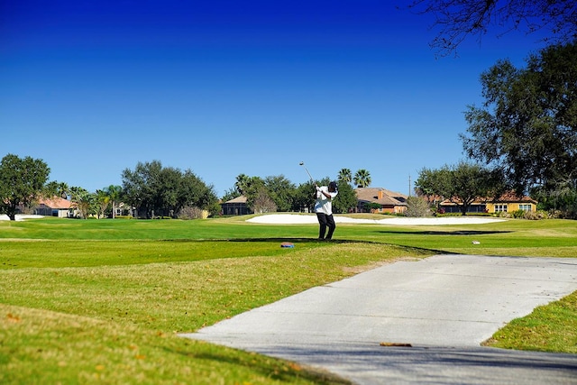 surrounding community featuring a lawn