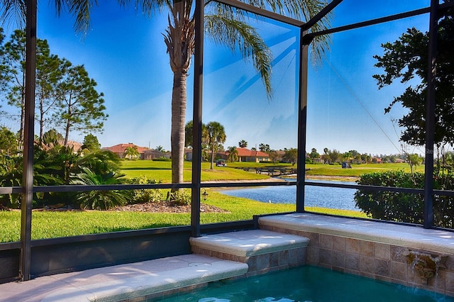 unfurnished sunroom with a water view and a jacuzzi