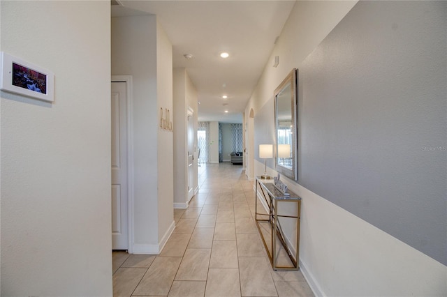 hallway with light tile patterned flooring