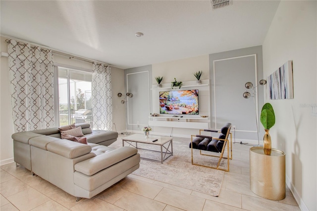 living room with light tile patterned floors