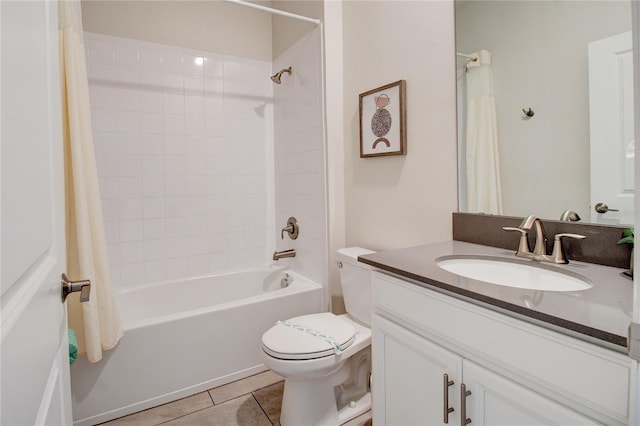 full bathroom featuring tile patterned flooring, vanity, toilet, and shower / bathtub combination with curtain