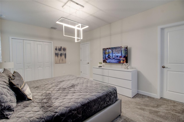 carpeted bedroom with a closet