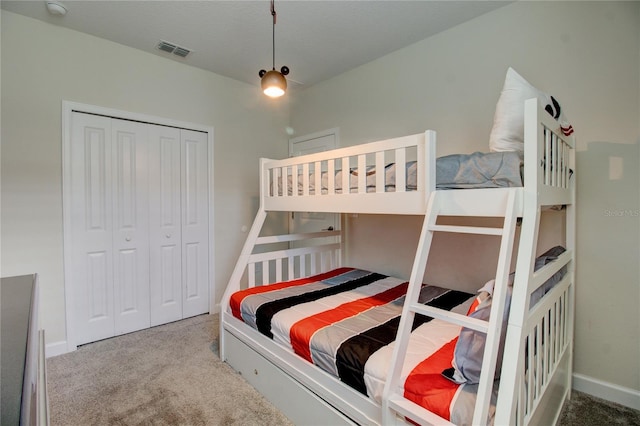 carpeted bedroom with a closet